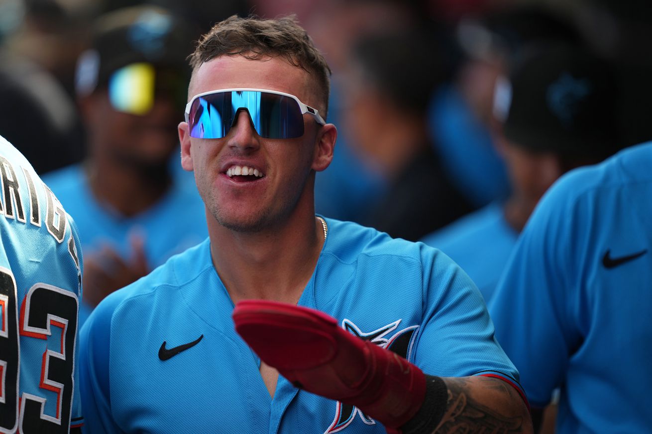 Peyton Burdick #6 of the Miami Marlins celebrates with teammates in the dugout after scoring a run in the game against the New York Mets at Roger Dean Stadium on March 4, 2023 in Jupiter, Florida.