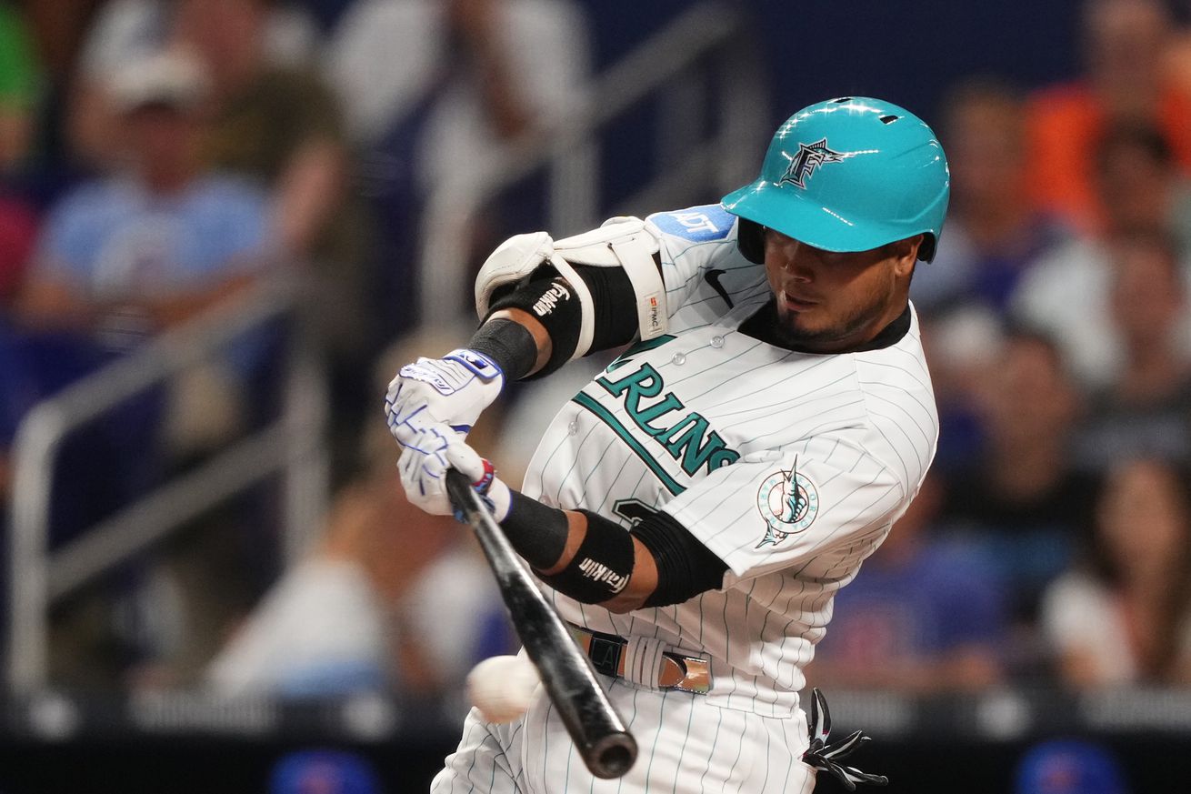 Luis Arraez #3 of the Miami Marlins singles in the game against the Chicago Cubs at loanDepot park on April 28, 2023 in Miami, Florida.