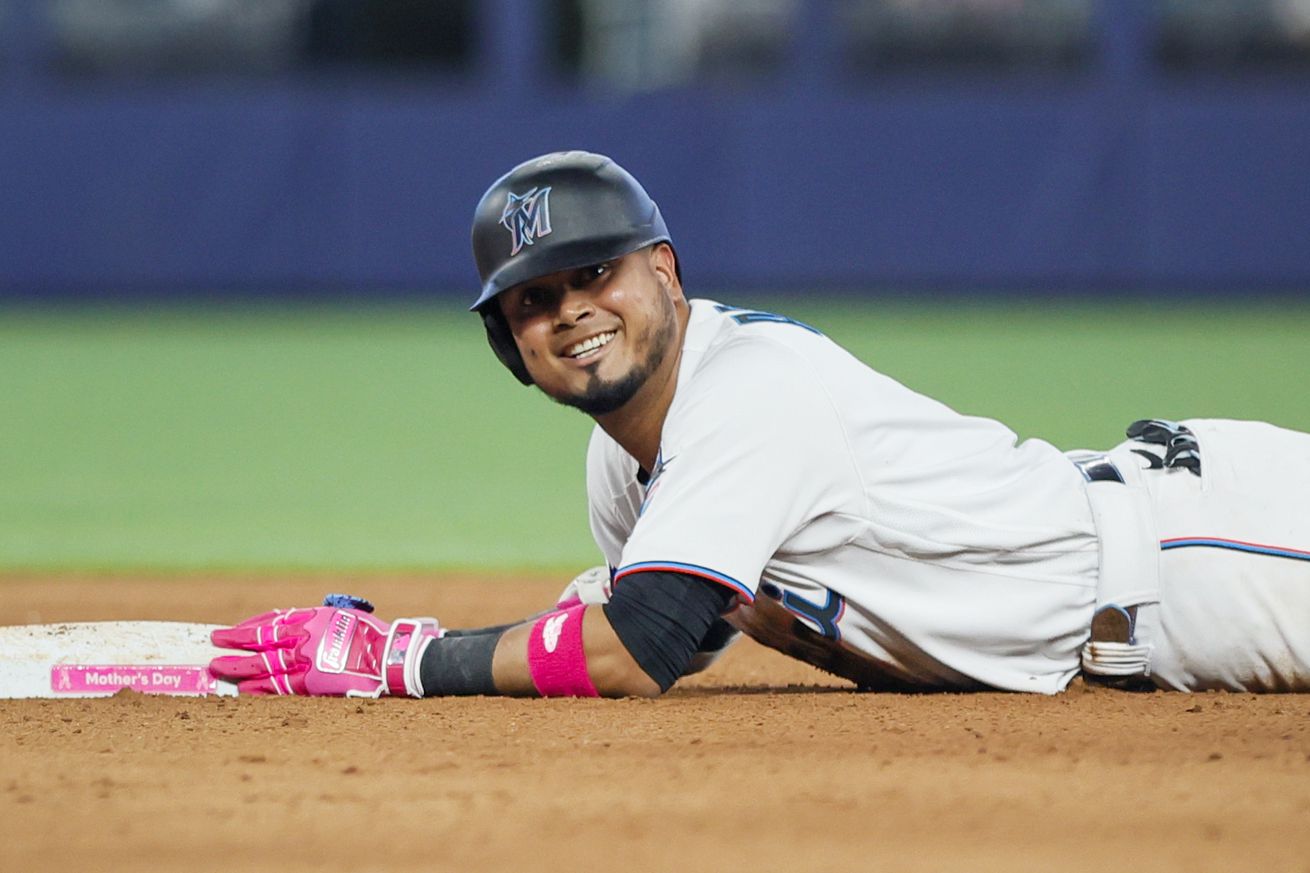 Luis Arraez #3 of the Miami Marlins reacts from second base after hitting a double against the Cincinnati Reds during the seventh inning at loanDepot park on May 14, 2023 in Miami, Florida.