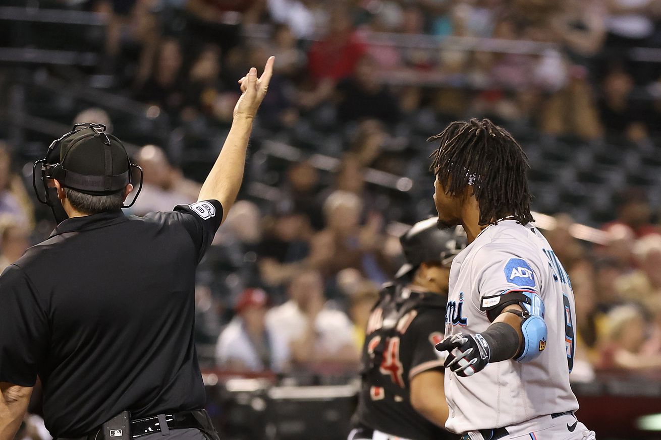 Jean Segura #9 of the Miami Marlins is ejected by home plate umpire Mark Ripperger #90 during the sixth inning of the MLB game against the Arizona Diamondbacks at Chase Field on May 08, 2023 in Phoenix, Arizona.