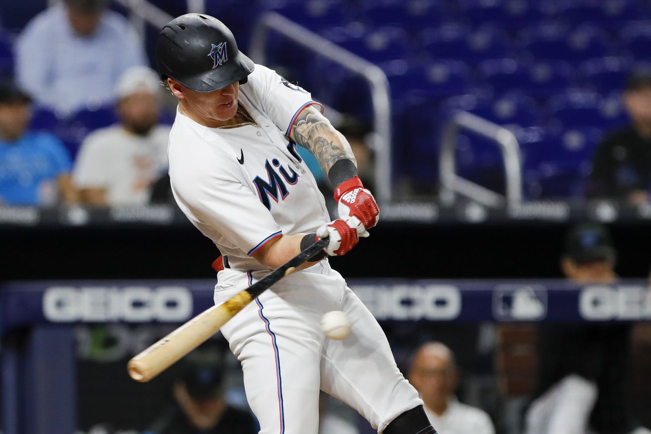 Miami Marlins center fielder Peyton Burdick (86) hits an infield single during the fifth inning against the Tampa Bay Rays at loanDepot Park.