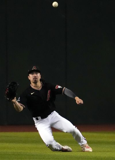 Arizona Diamondbacks left fielder Corbin Carroll (7) is unable to run down a line drive against the Miami Marlins during the fifth inning at Chase Field.