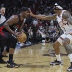 Miami Heat forward Jimmy Butler (22) is guarded by Phoenix Suns guard Bradley Beal (3)